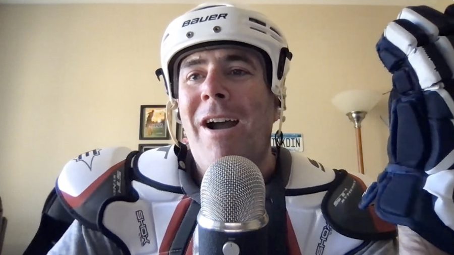 John Nemo on a client Zoom call in full hockey gear